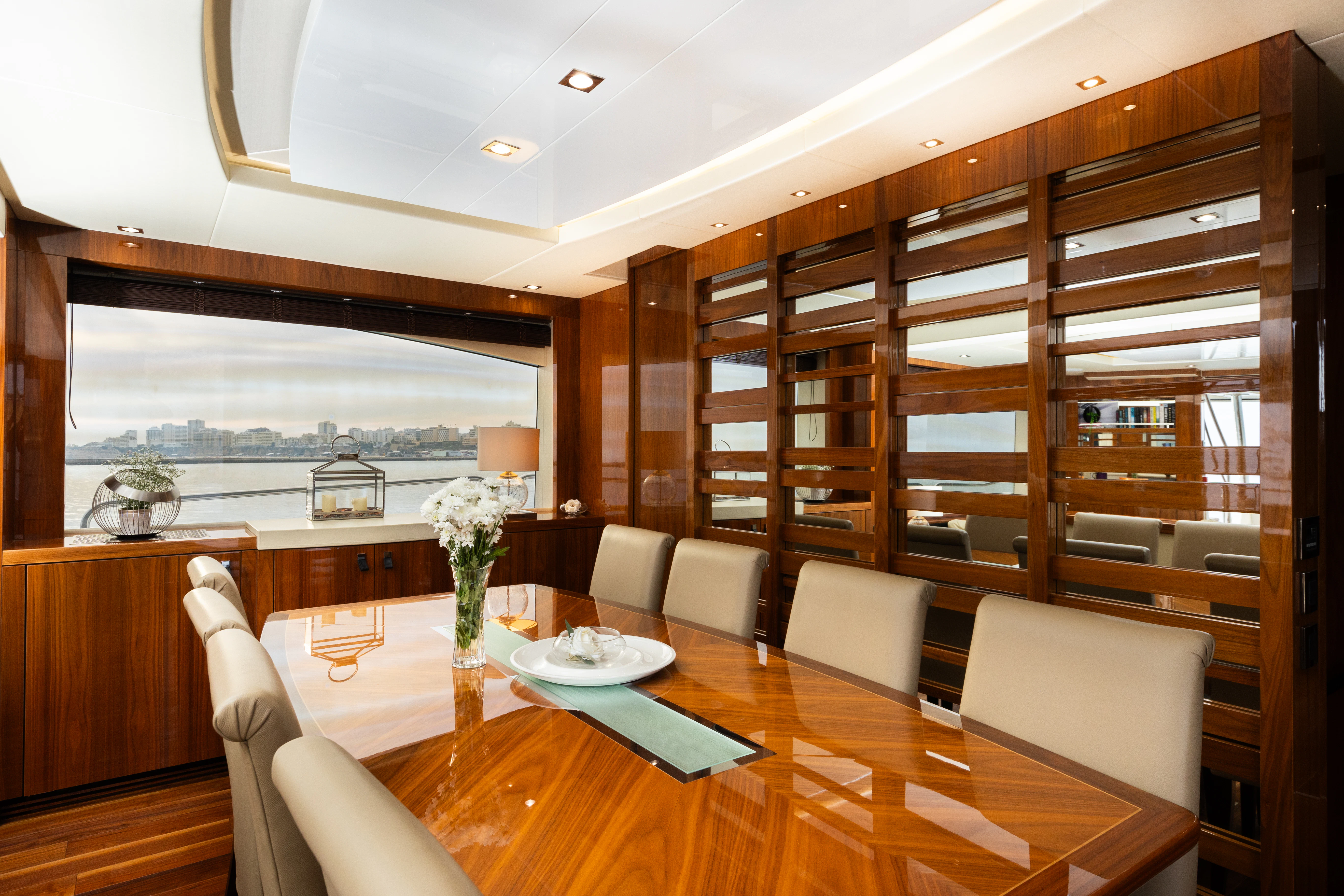 a room with a table chairs and a large window aboard STARDUST OF MARY Yacht for Sale
