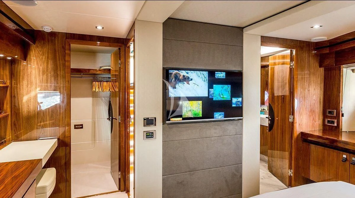 a room with a large screen aboard STARDUST OF MARY Yacht for Sale