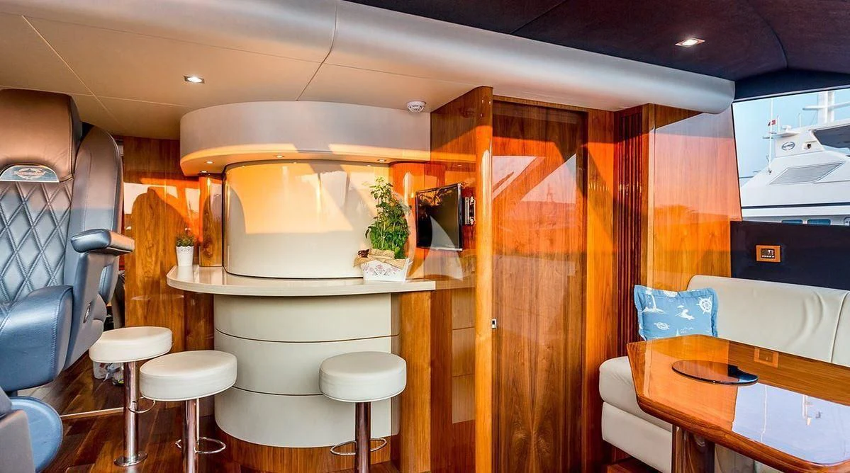 a room with a table and chairs aboard STARDUST OF MARY Yacht for Sale