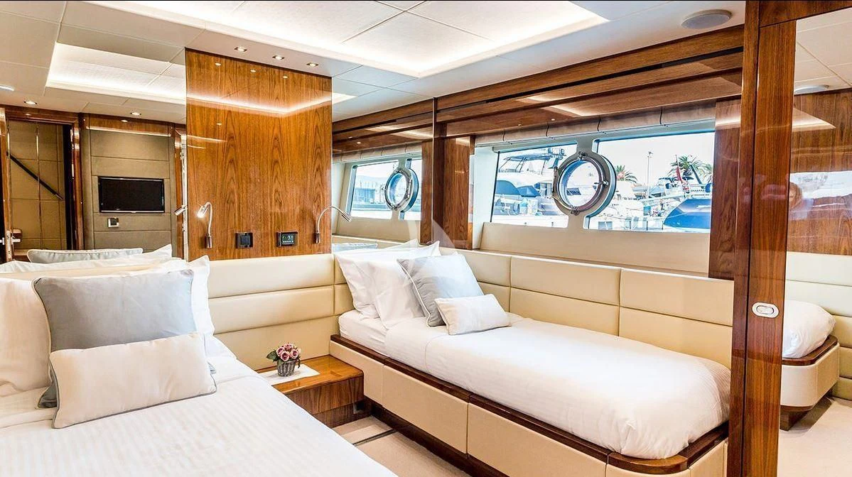 a room with a bed and a window aboard STARDUST OF MARY Yacht for Sale