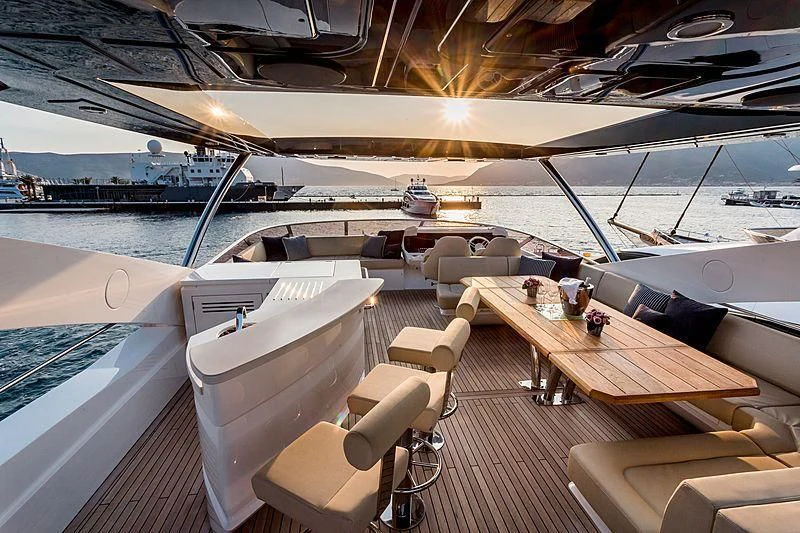 a deck with a view of the water and boats on it aboard STARDUST OF MARY Yacht for Sale