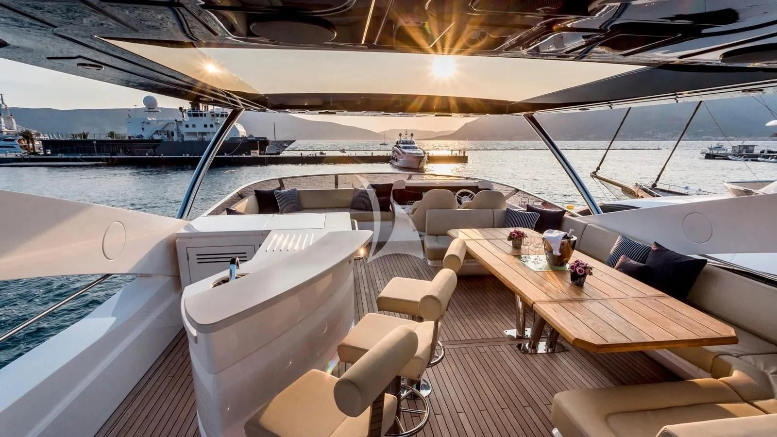 a deck with a view of the water and boats aboard STARDUST OF MARY Yacht for Sale