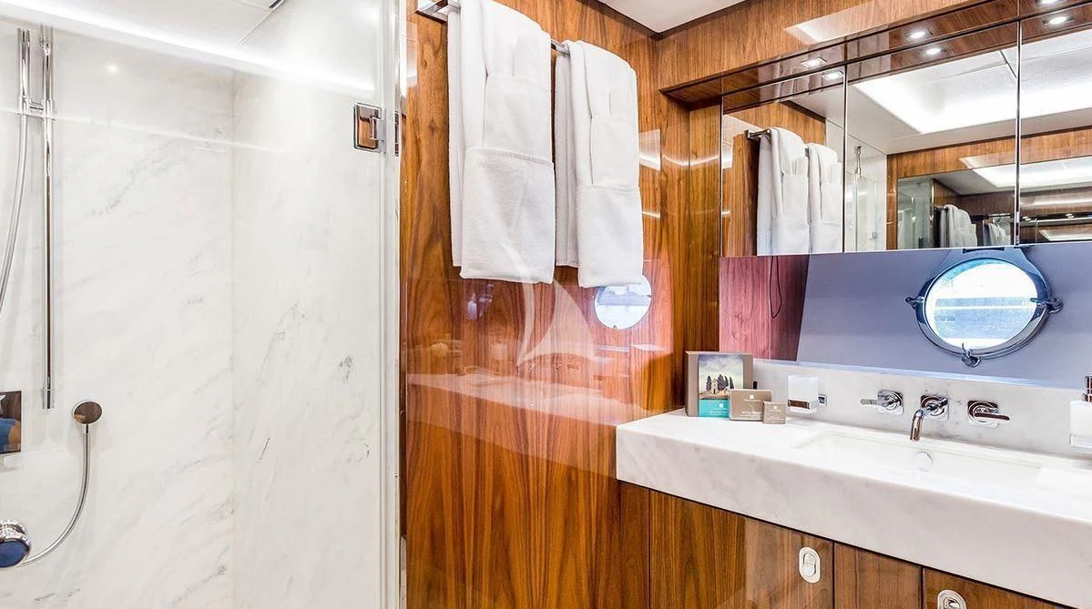 a bathroom with a sink and a mirror aboard STARDUST OF MARY Yacht for Sale