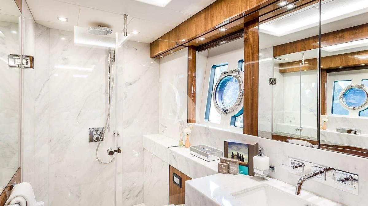 a bathroom with a large mirror aboard STARDUST OF MARY Yacht for Sale