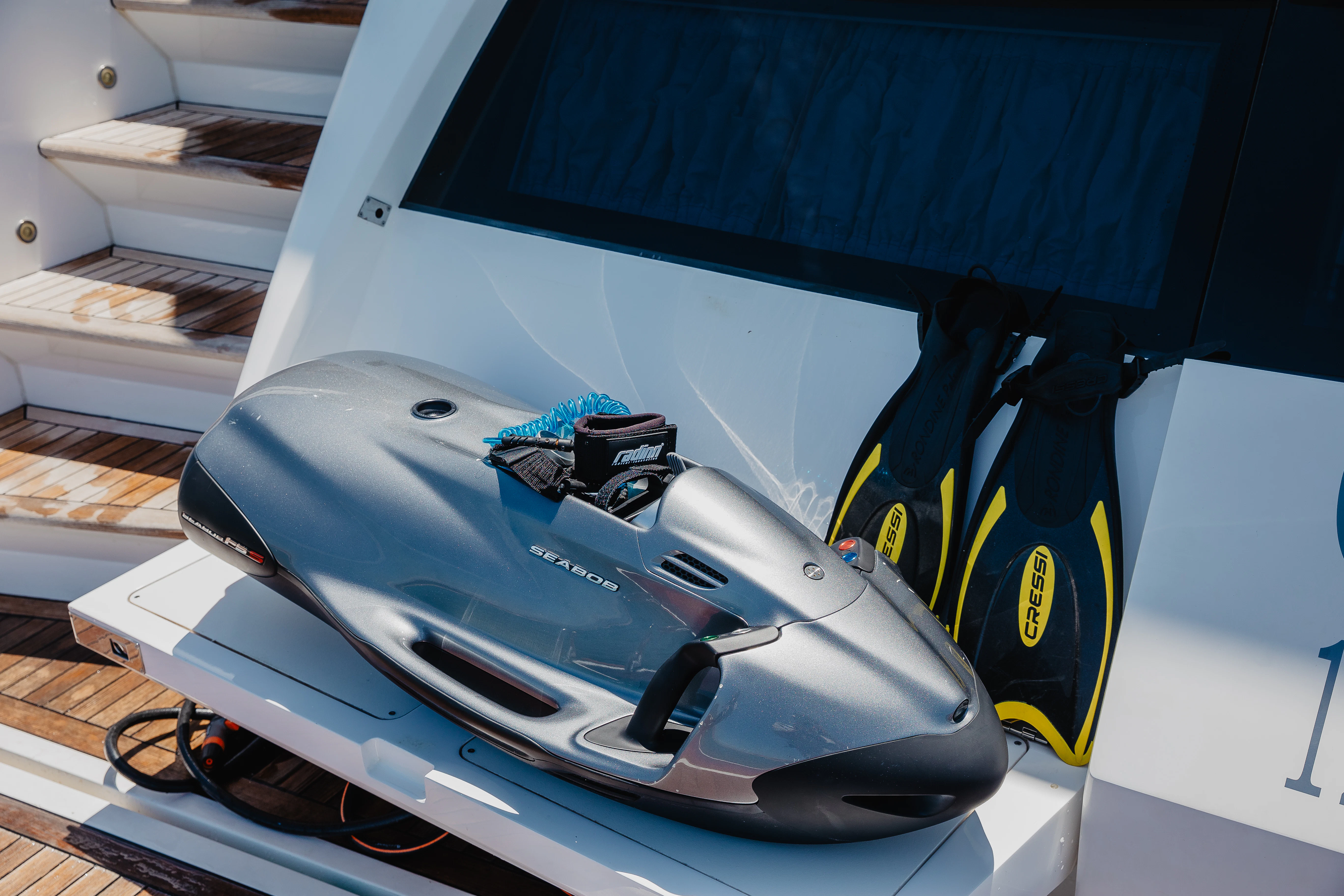 a blue and white race car aboard STARDUST OF MARY Yacht for Sale