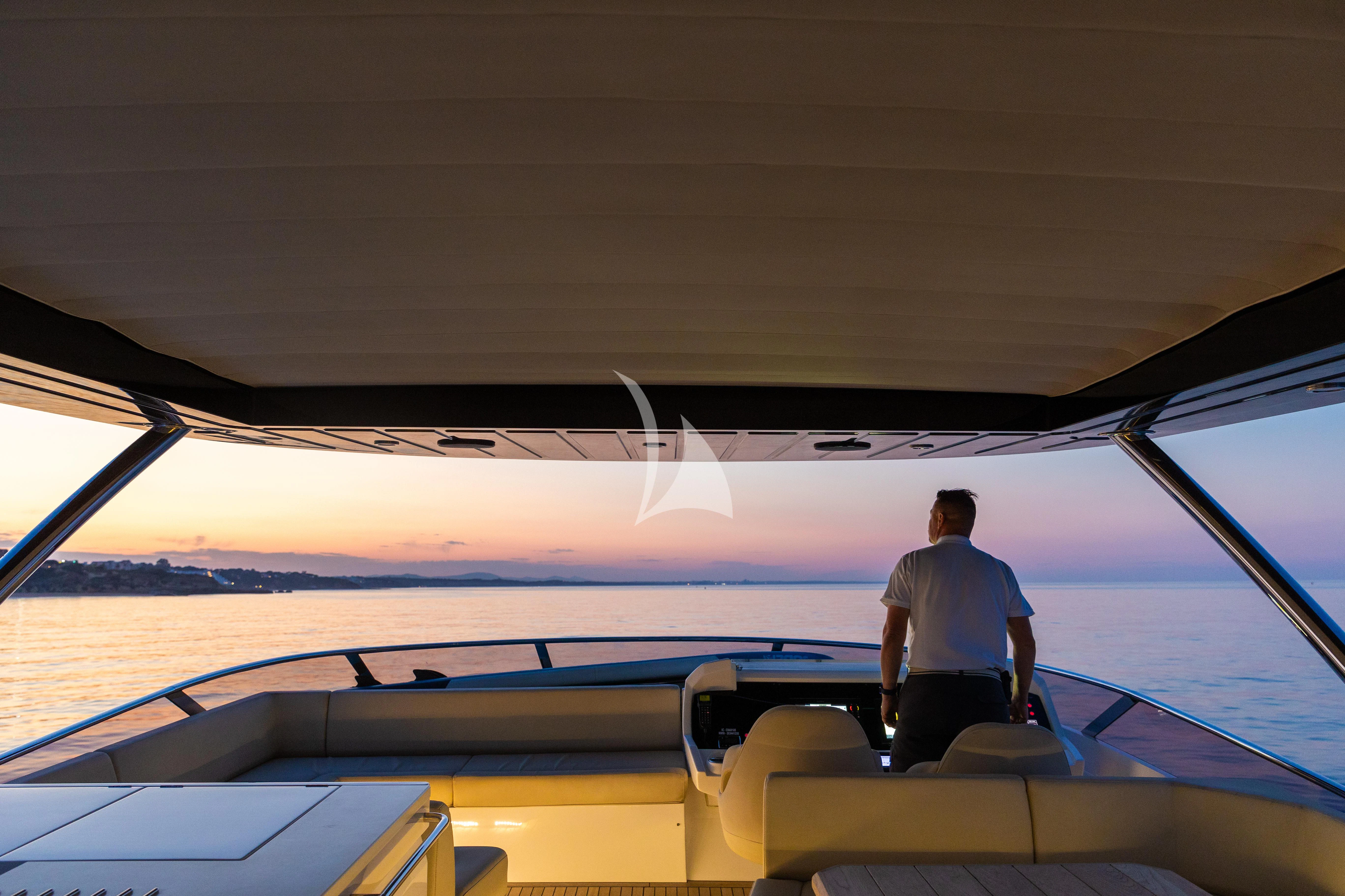 a person standing on the deck of a boat aboard STARDUST OF MARY Yacht for Sale