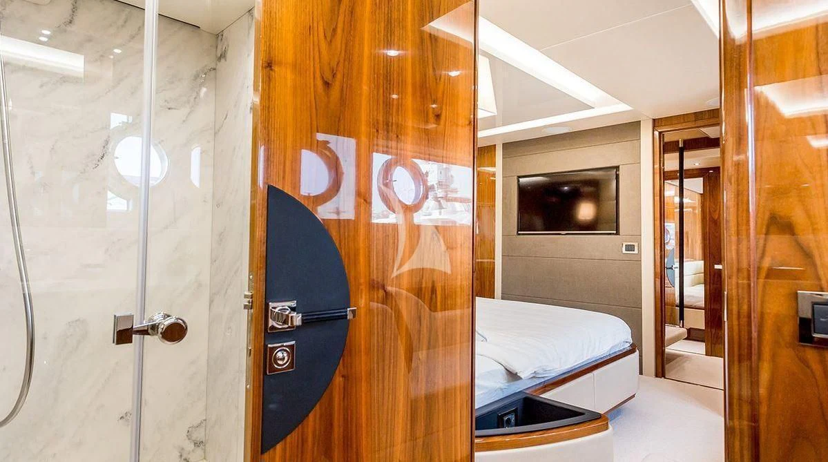 a room with a bed and a television aboard STARDUST OF MARY Yacht for Sale