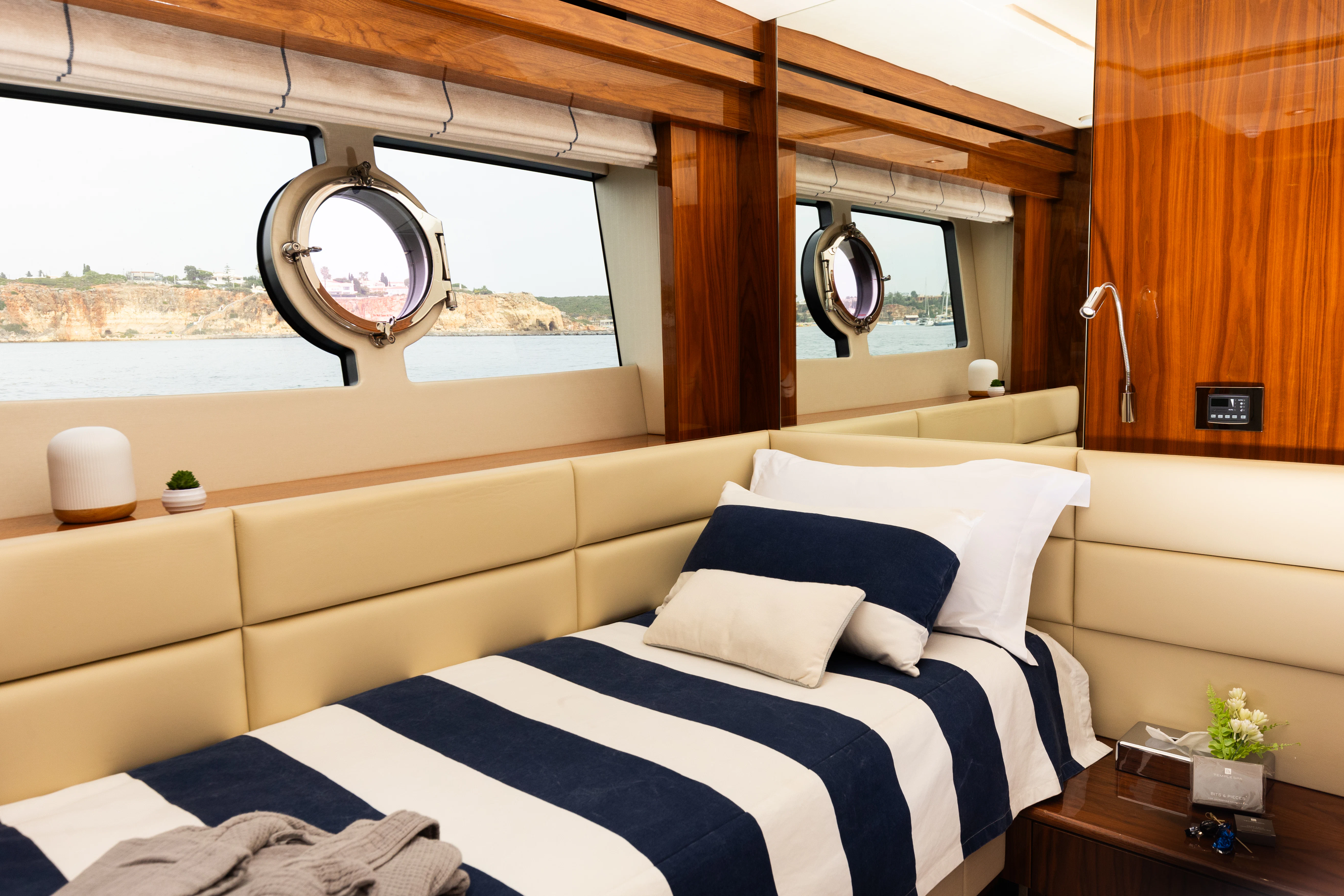 a room with a bed and a window aboard STARDUST OF MARY Yacht for Sale
