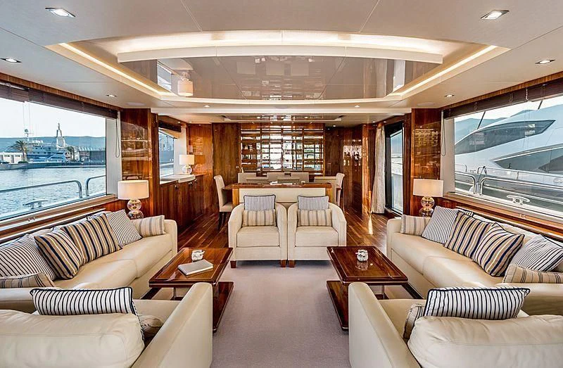 a living room with a large window aboard STARDUST OF MARY Yacht for Sale