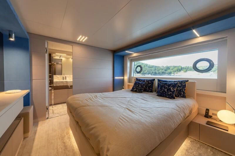 a bedroom with a large bed aboard FRANGELO Yacht for Sale