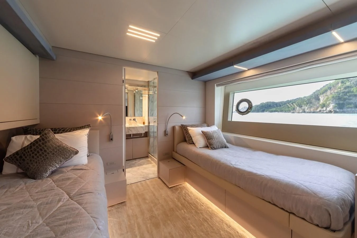 a bedroom with a large window aboard FRANGELO Yacht for Sale