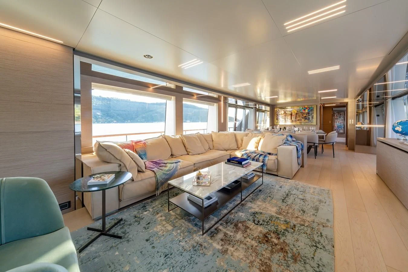 a living room with a couch and a coffee table aboard FRANGELO Yacht for Sale