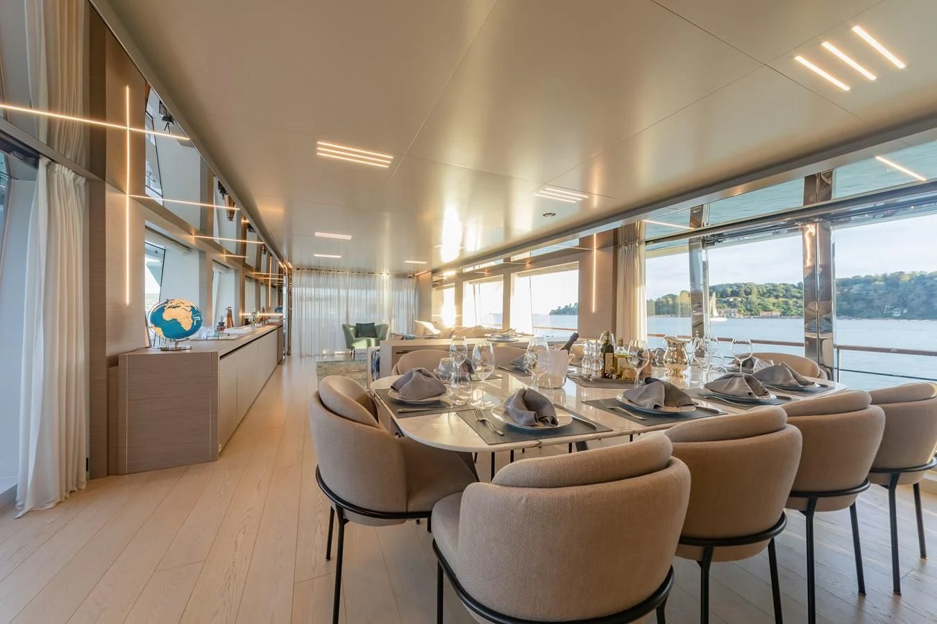 a large dining room with a large window aboard FRANGELO Yacht for Sale