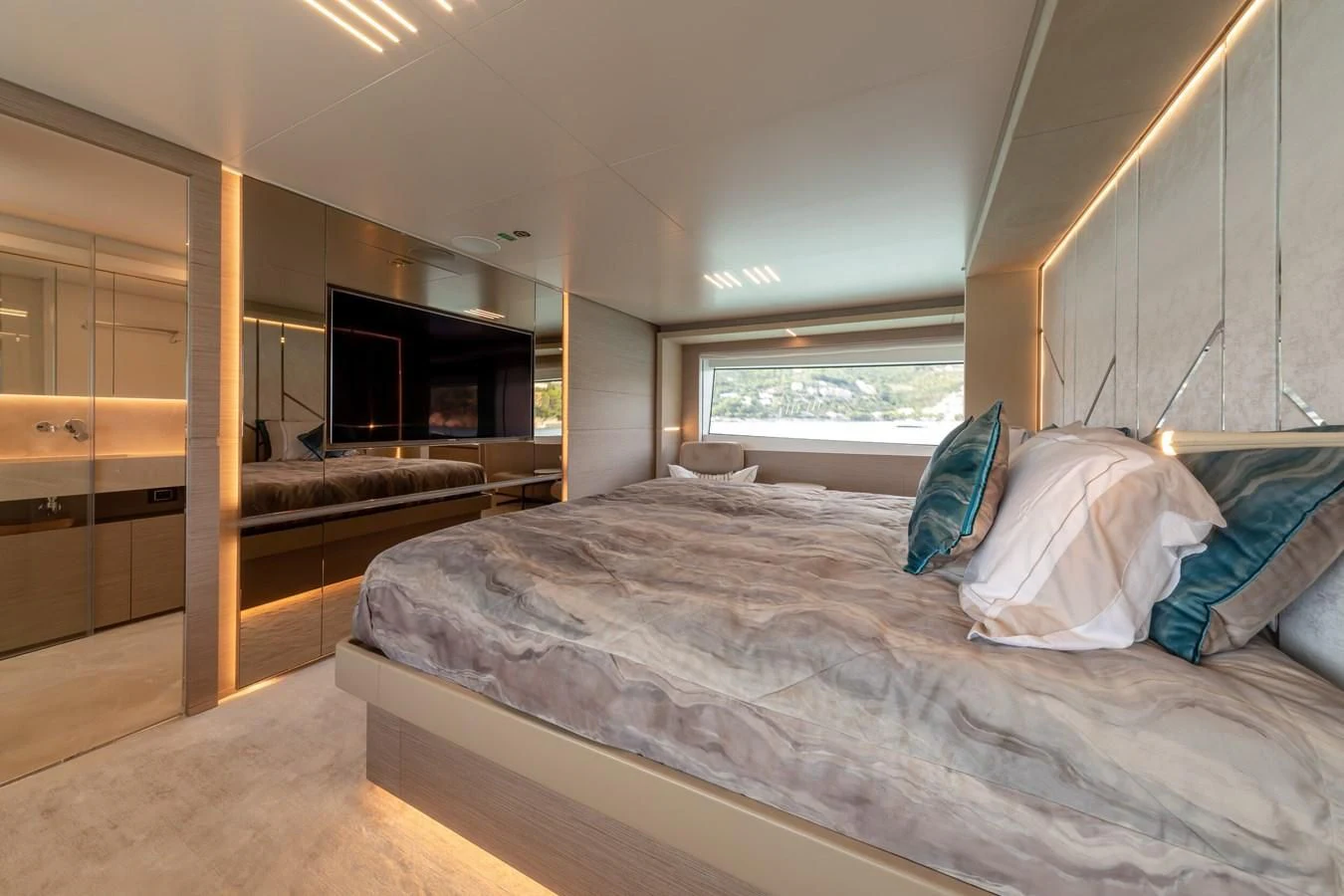 a bedroom with a large bed aboard FRANGELO Yacht for Sale