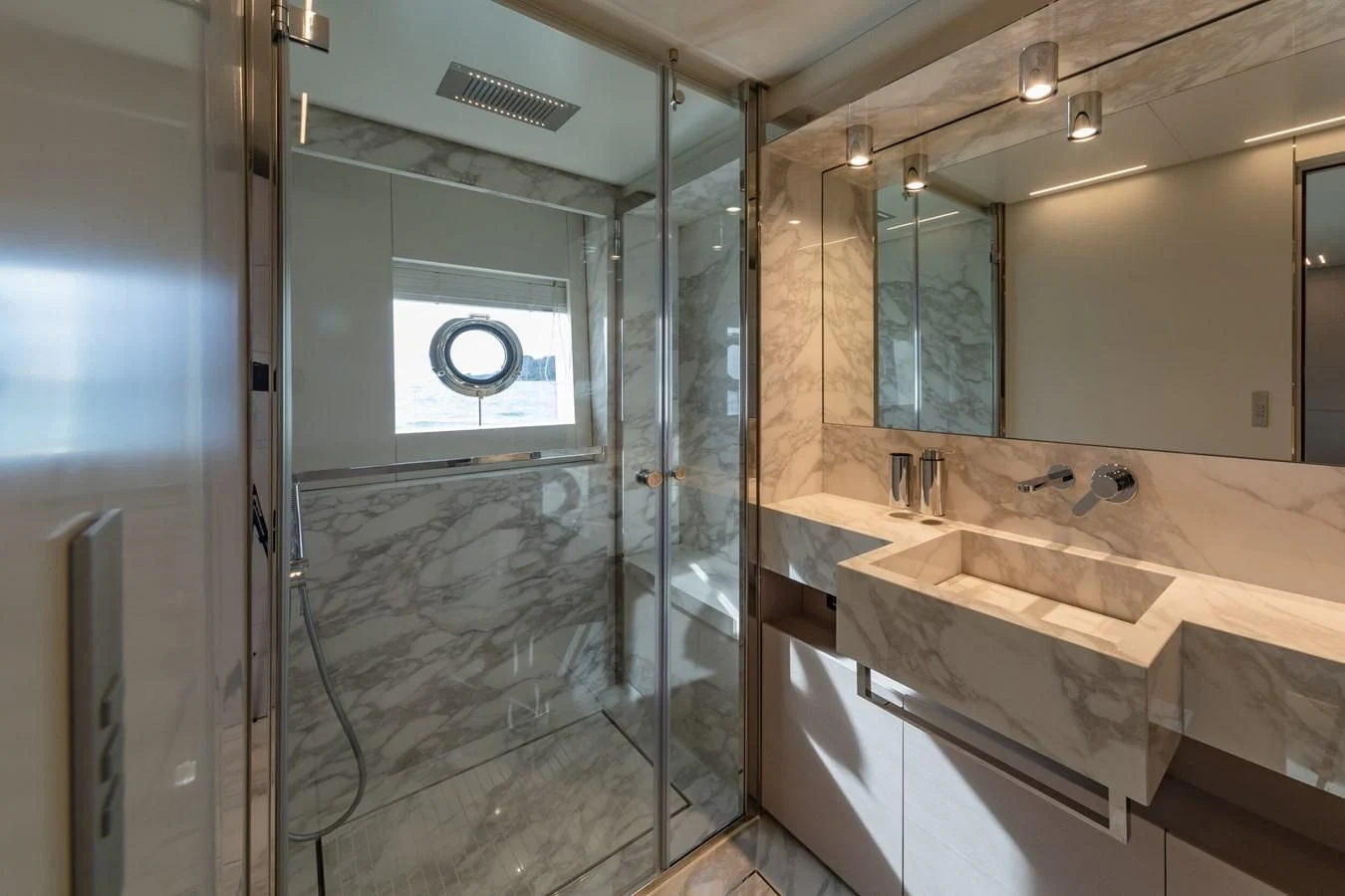 a bathroom with a glass shower aboard FRANGELO Yacht for Sale