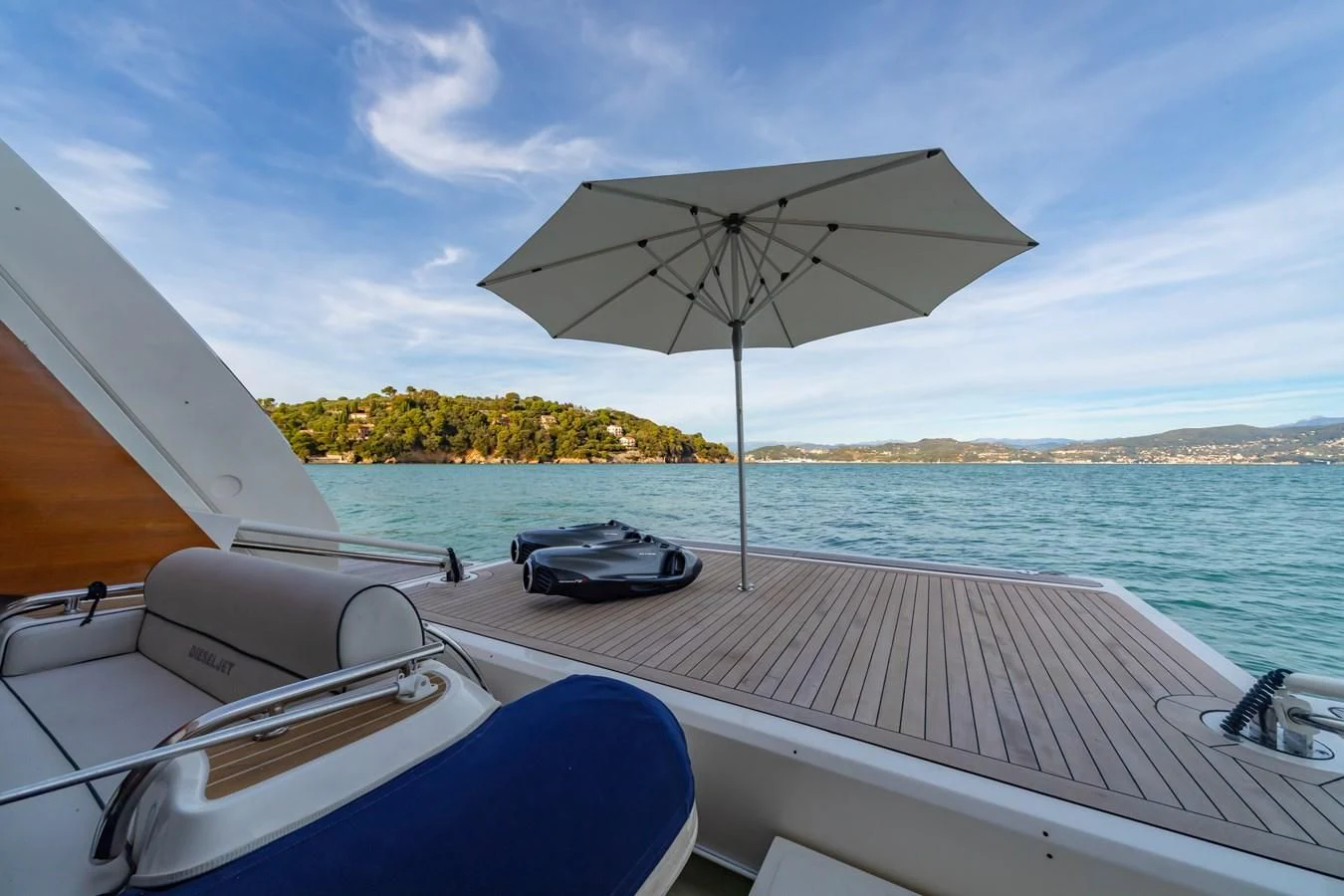 a boat with an umbrella on it aboard FRANGELO Yacht for Sale