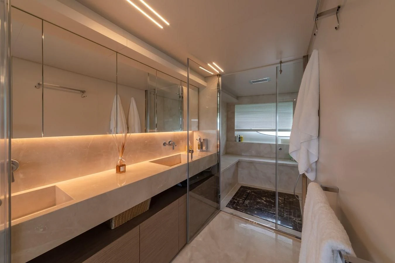 a bathroom with a glass shower aboard FRANGELO Yacht for Sale