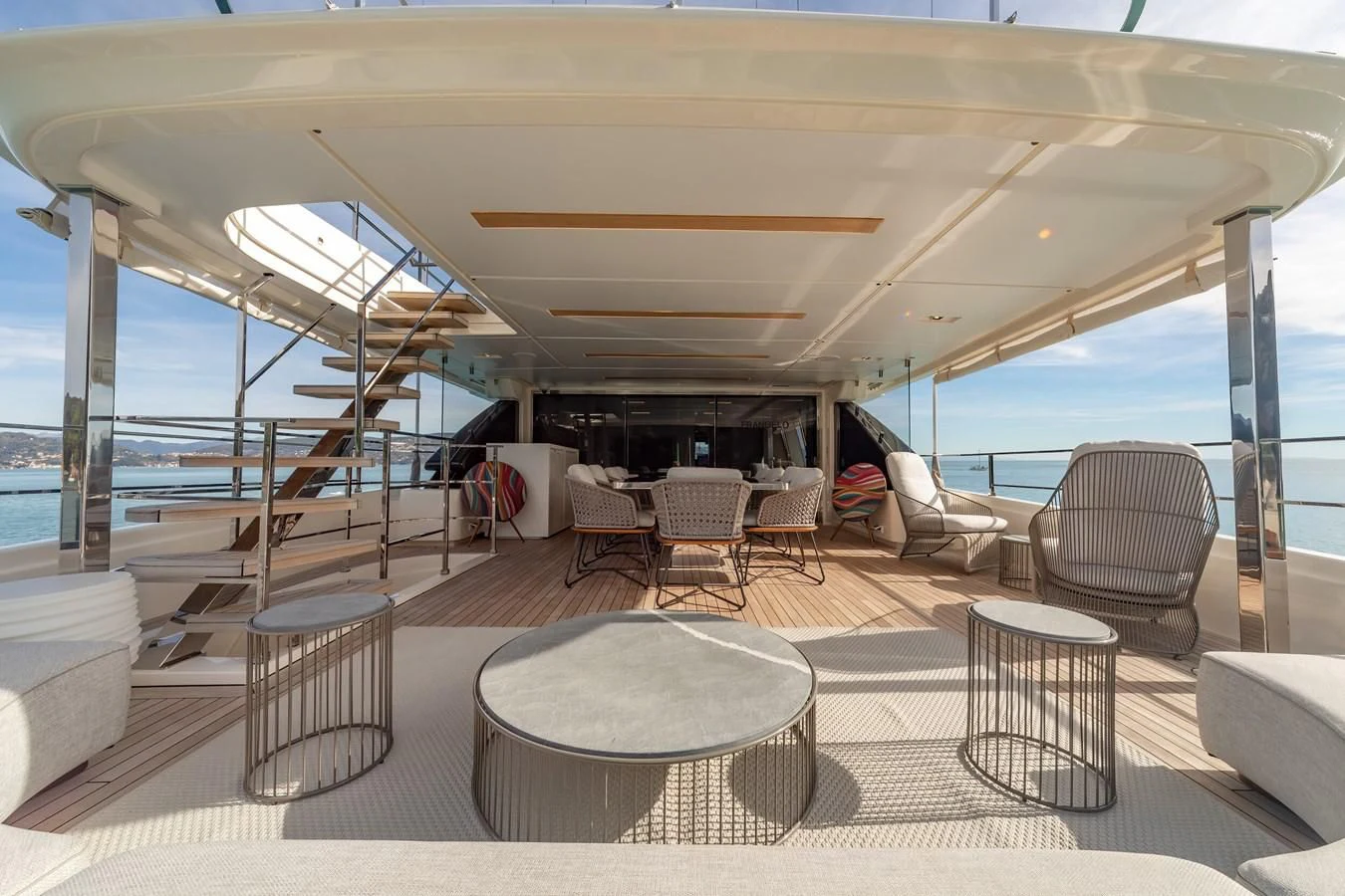 a room with a table and chairs aboard FRANGELO Yacht for Sale