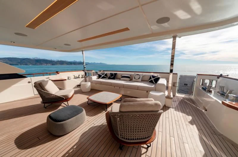 a room with a view of the ocean and the deck aboard FRANGELO Yacht for Sale