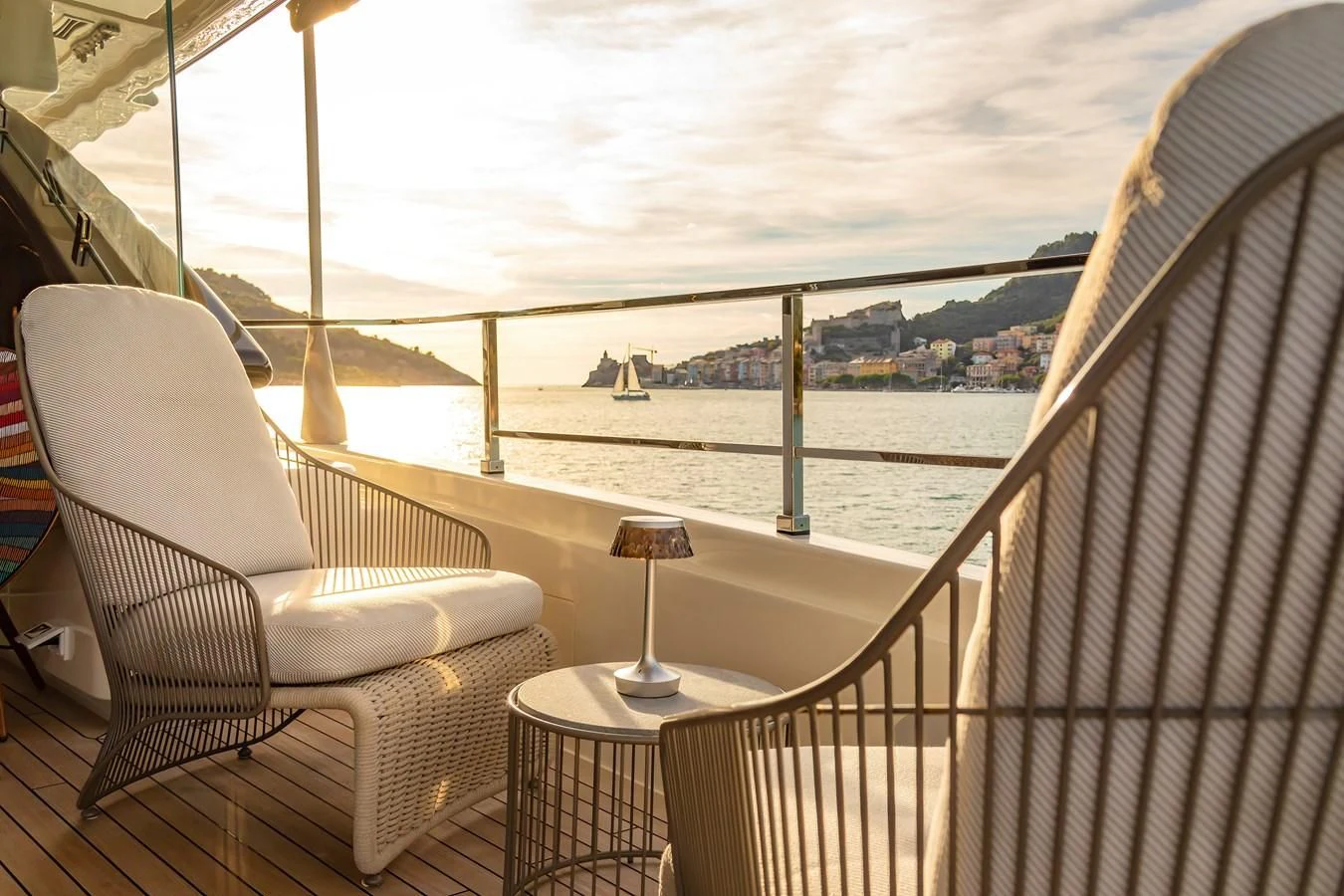 a balcony overlooking a body of water aboard FRANGELO Yacht for Sale