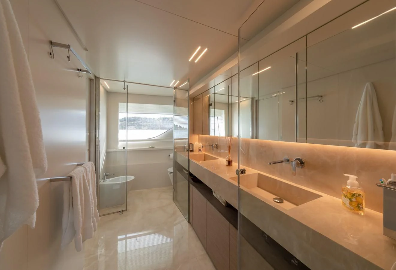 a bathroom with a large mirror aboard FRANGELO Yacht for Sale