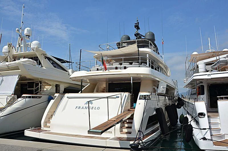 a boat docked at a pier aboard FRANGELO Yacht for Sale