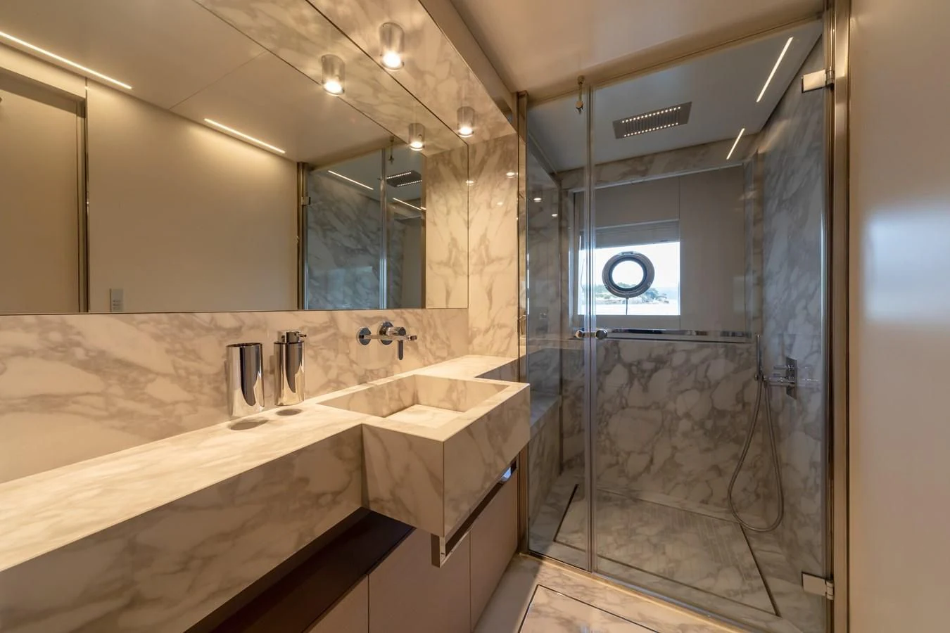 a bathroom with a large mirror aboard FRANGELO Yacht for Sale