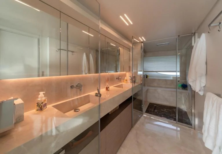 a bathroom with a large mirror aboard FRANGELO Yacht for Sale