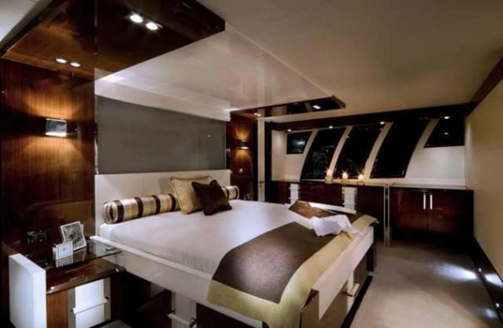 a bedroom with a bed and a desk aboard CHAPTER II Yacht for Sale