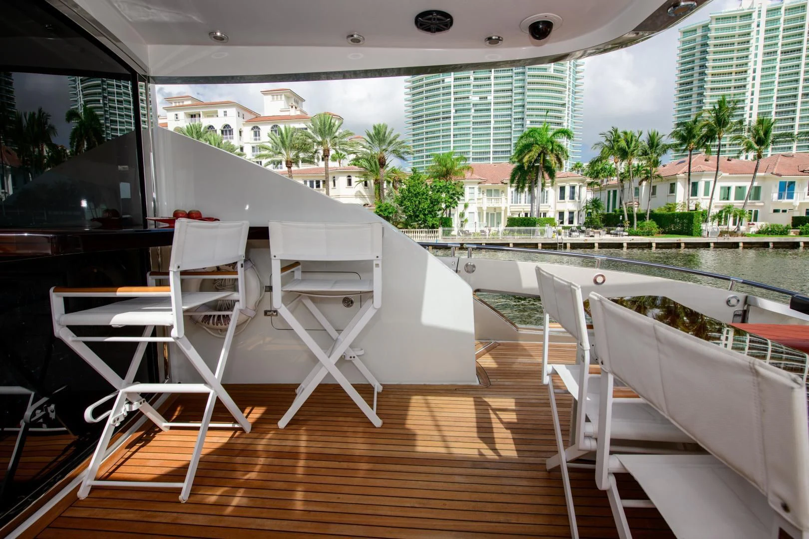 a deck with chairs and a pool aboard CHAPTER II Yacht for Sale