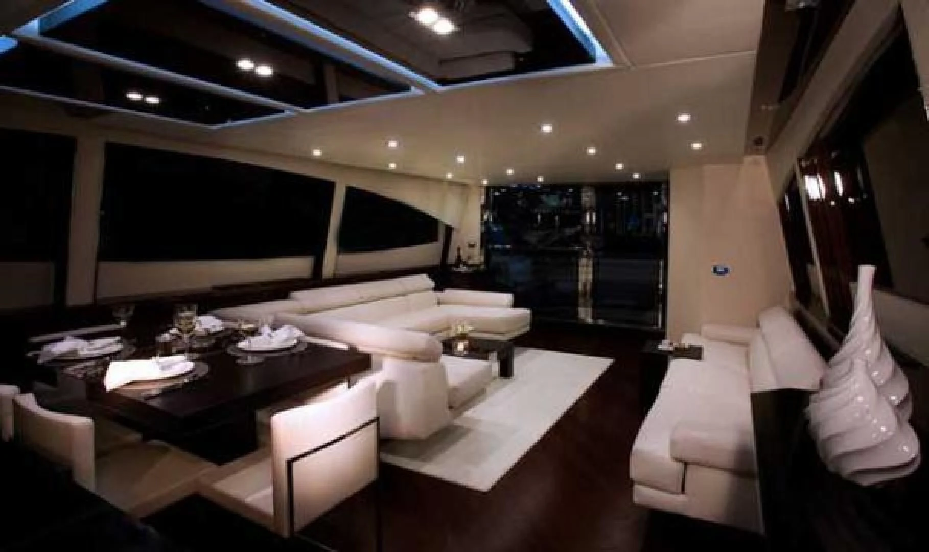 a room with a table and chairs aboard CHAPTER II Yacht for Sale