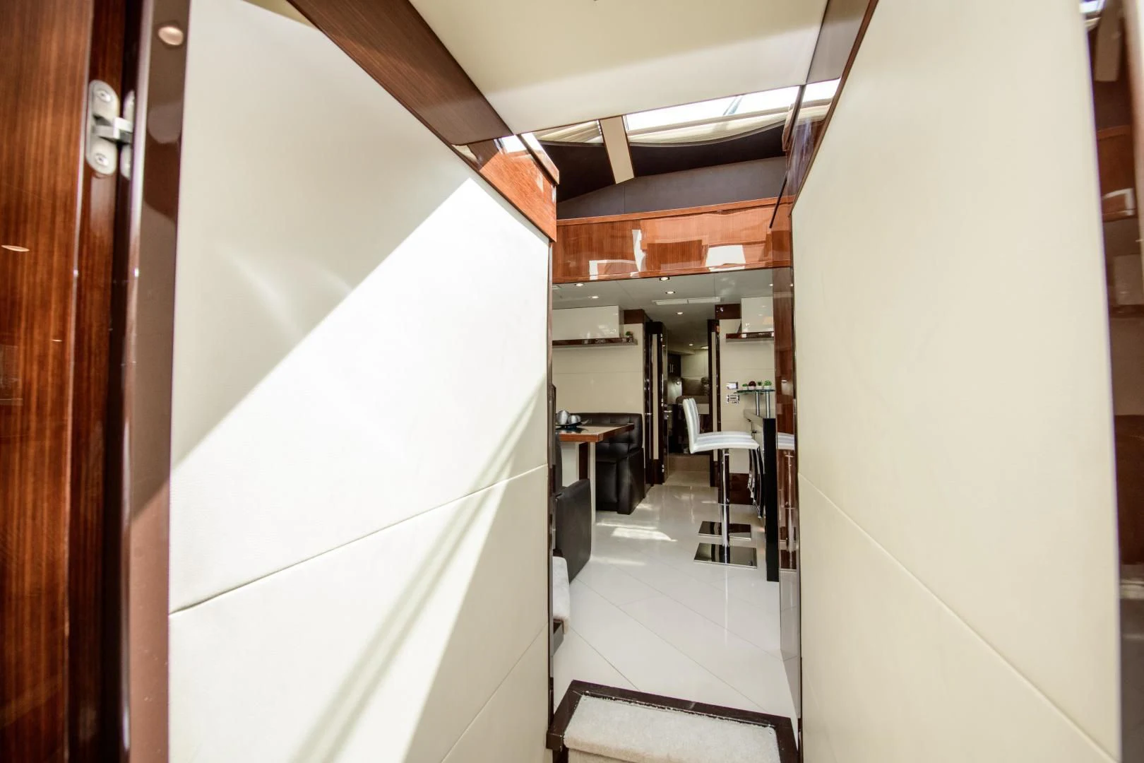 a hallway with a white wall aboard CHAPTER II Yacht for Sale