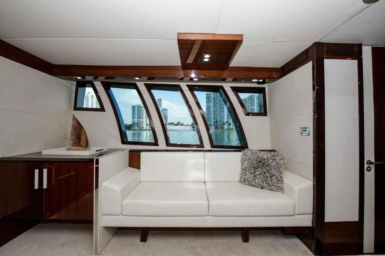 a white couch in a room aboard CHAPTER II Yacht for Sale