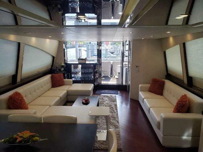 a living room with a large window aboard CHAPTER II Yacht for Sale