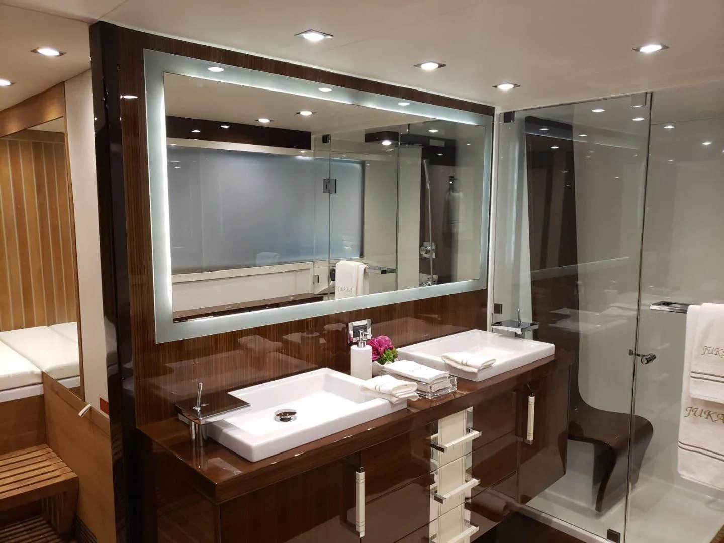 a bathroom with a large mirror aboard CHAPTER II Yacht for Sale