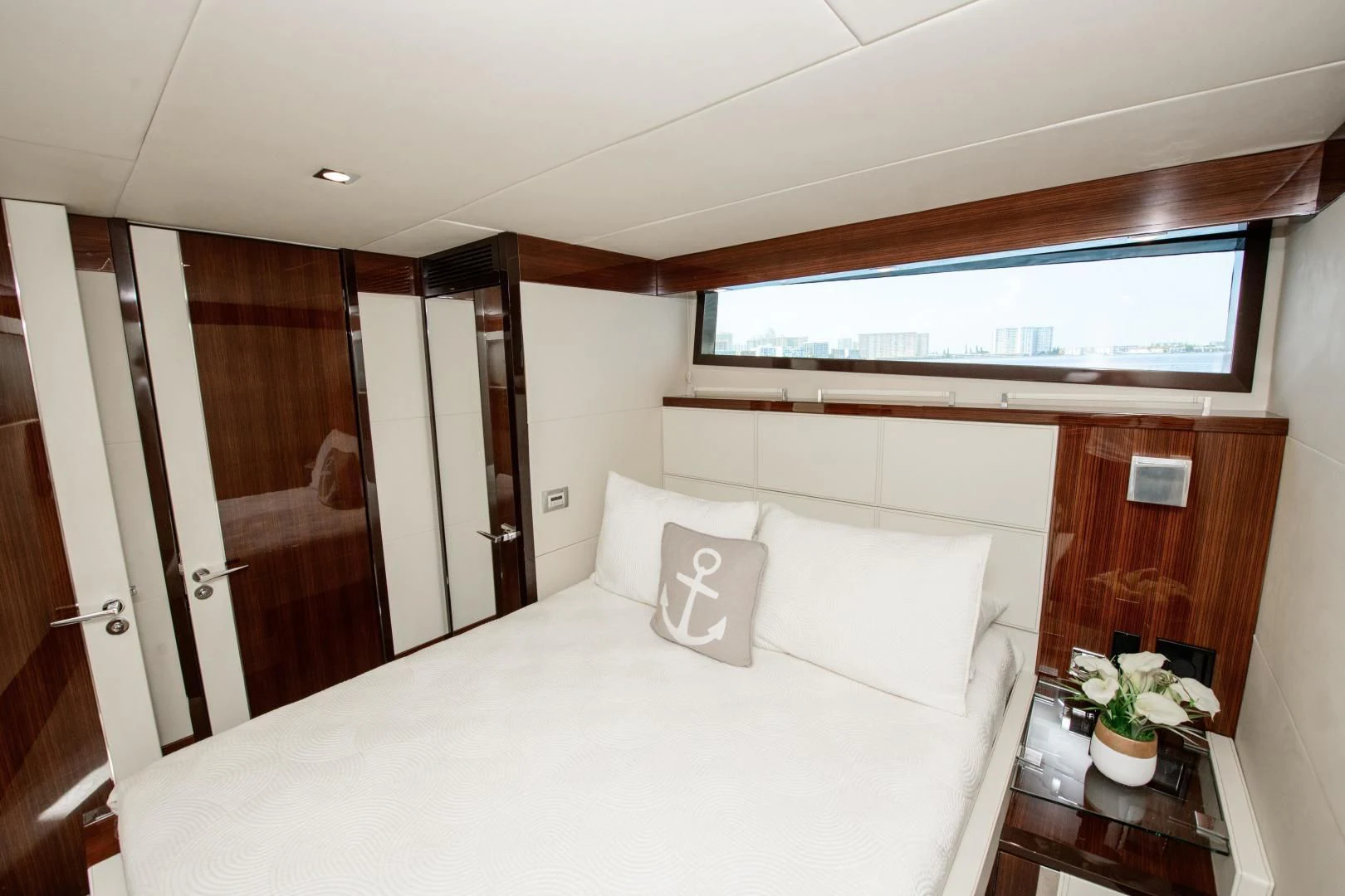 a bed with white sheets and pillows aboard CHAPTER II Yacht for Sale