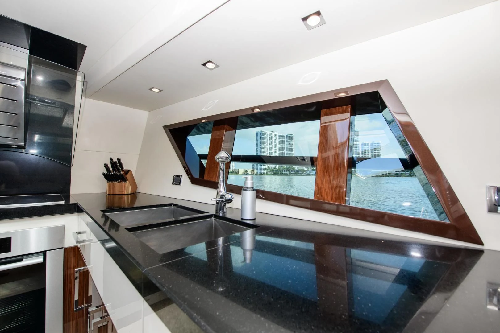a kitchen with a large glass window aboard CHAPTER II Yacht for Sale