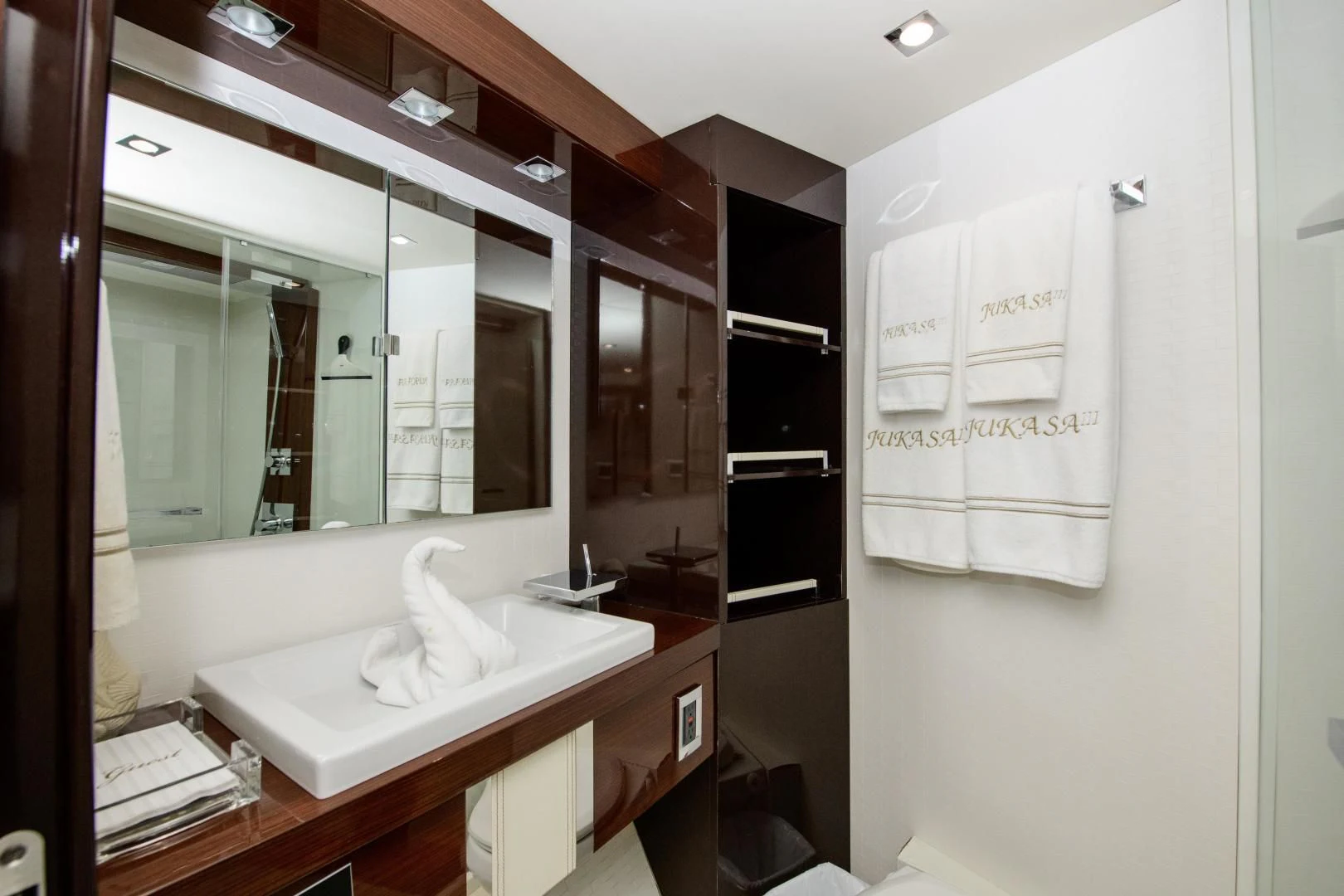 a bathroom with a large mirror aboard CHAPTER II Yacht for Sale