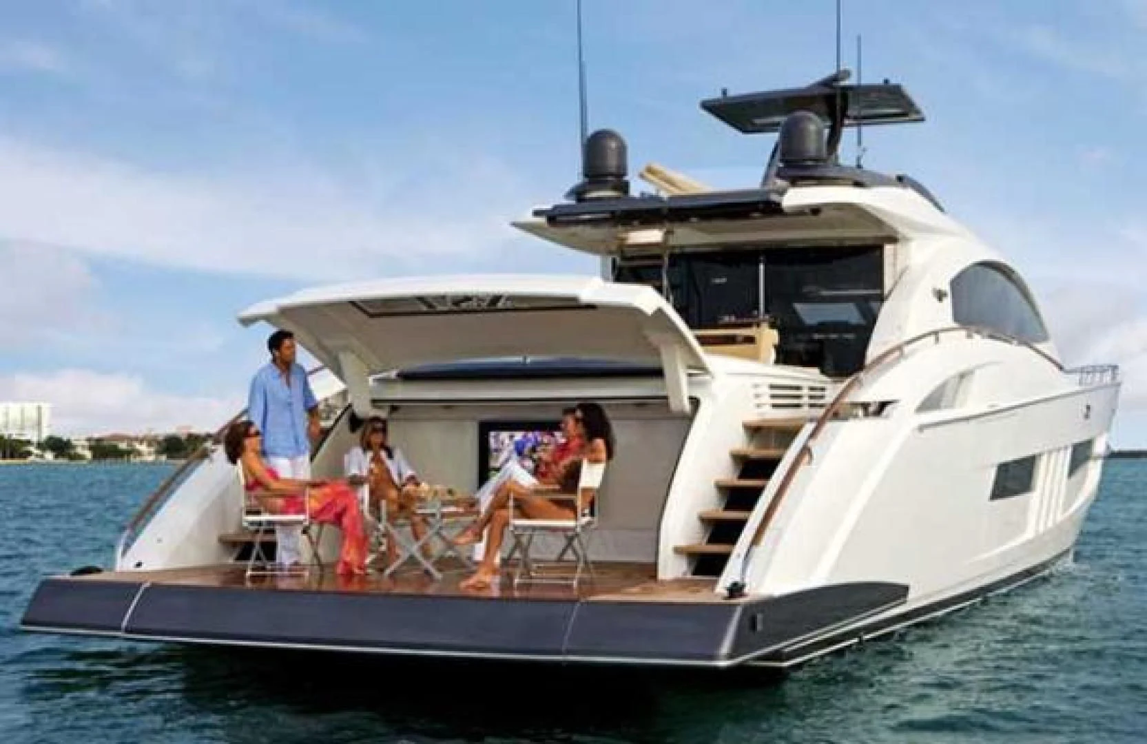 a group of people sitting on a boat aboard CHAPTER II Yacht for Sale