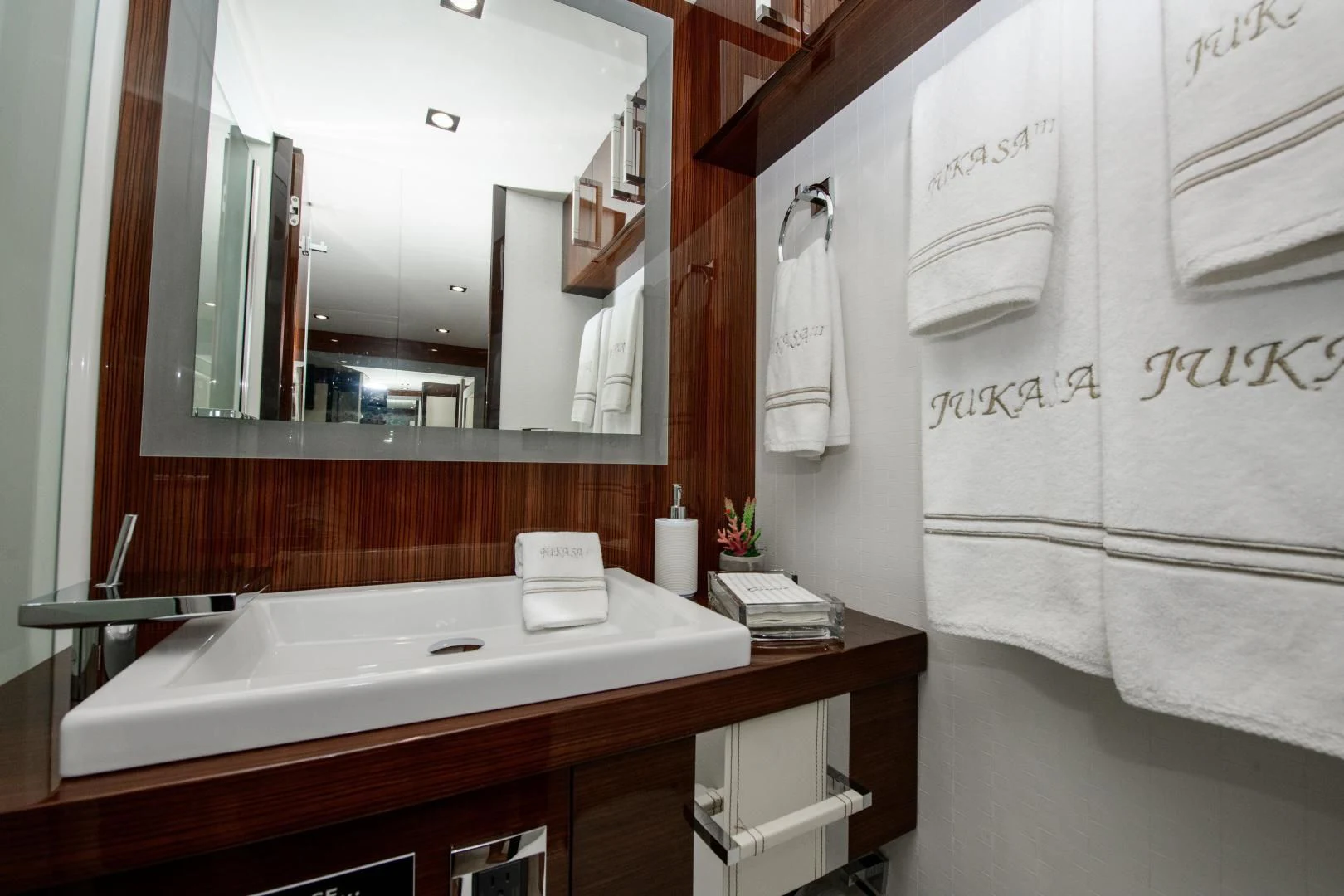 a bathroom with a large mirror aboard CHAPTER II Yacht for Sale
