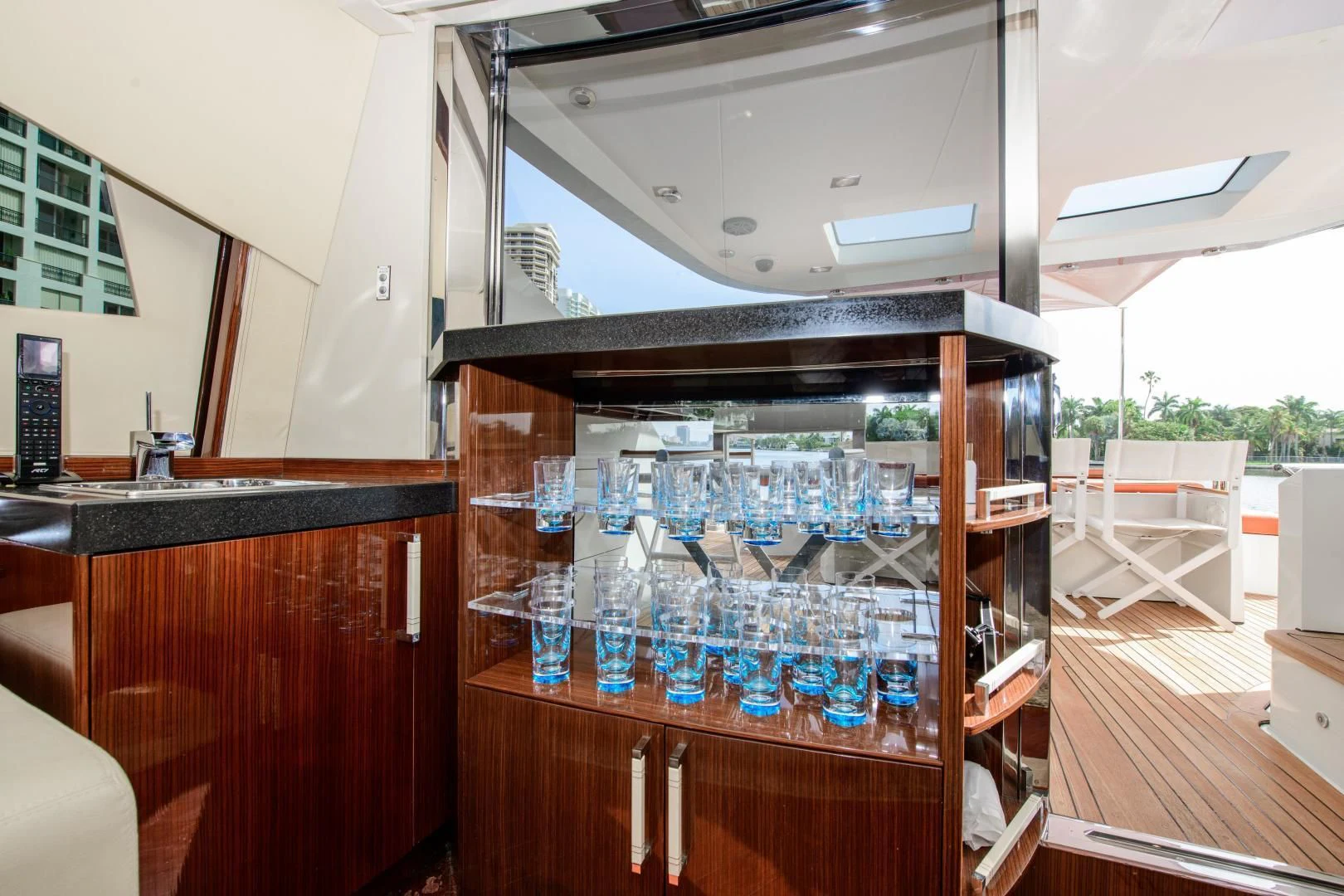 a glass shelf with blue liquid in a kitchen aboard CHAPTER II Yacht for Sale