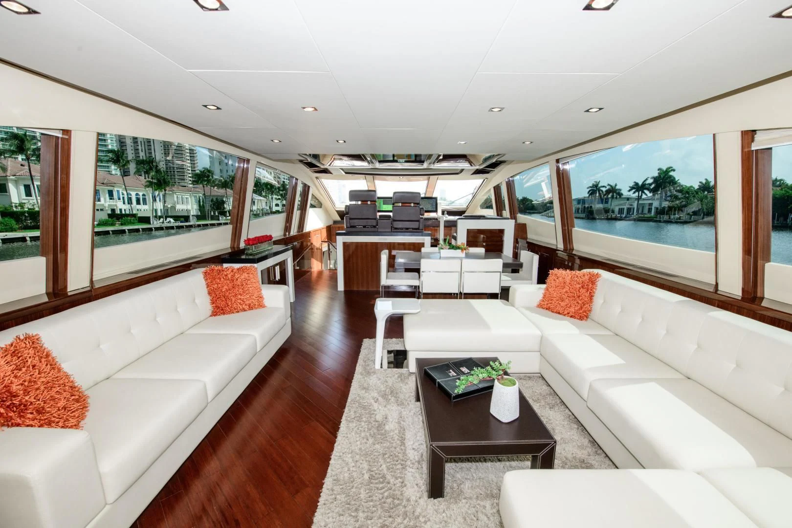 a living room with white couches aboard CHAPTER II Yacht for Sale