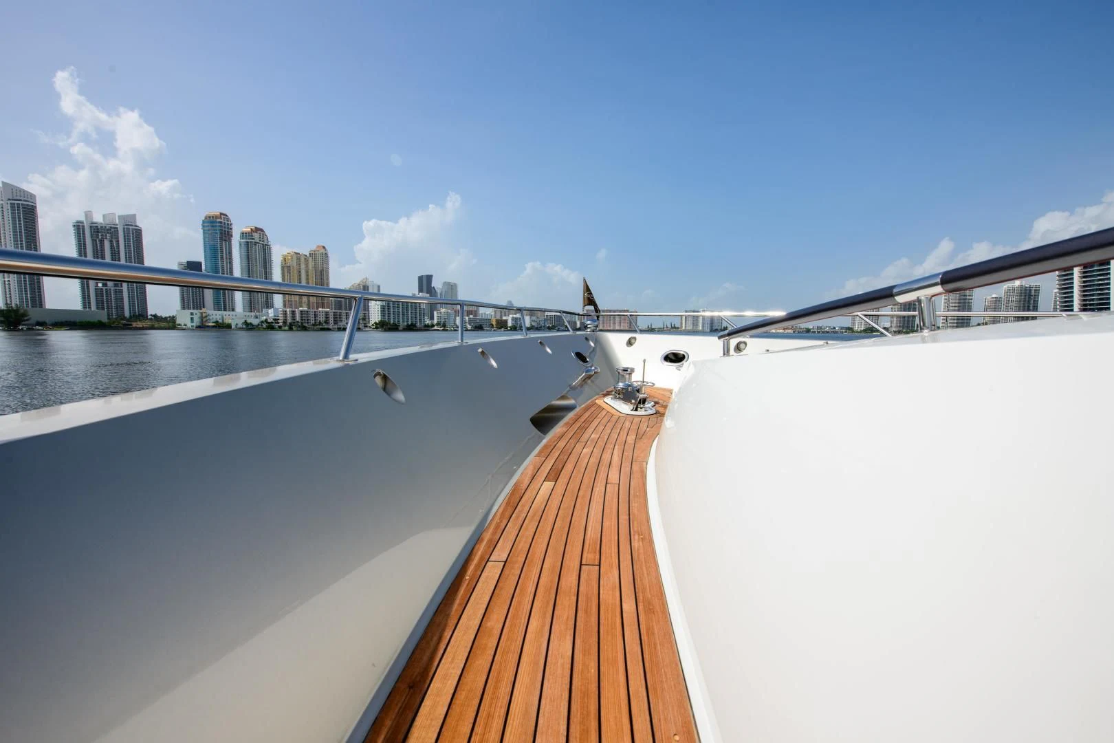 a deck with a view of a city and a body of water aboard CHAPTER II Yacht for Sale
