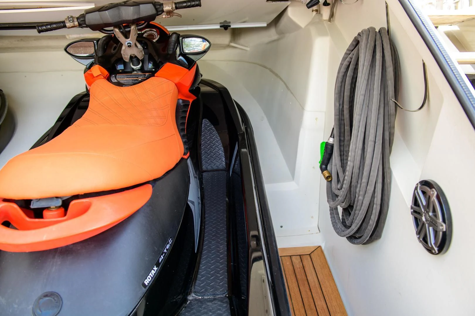 a dog in an orange and black car with a hood aboard CHAPTER II Yacht for Sale