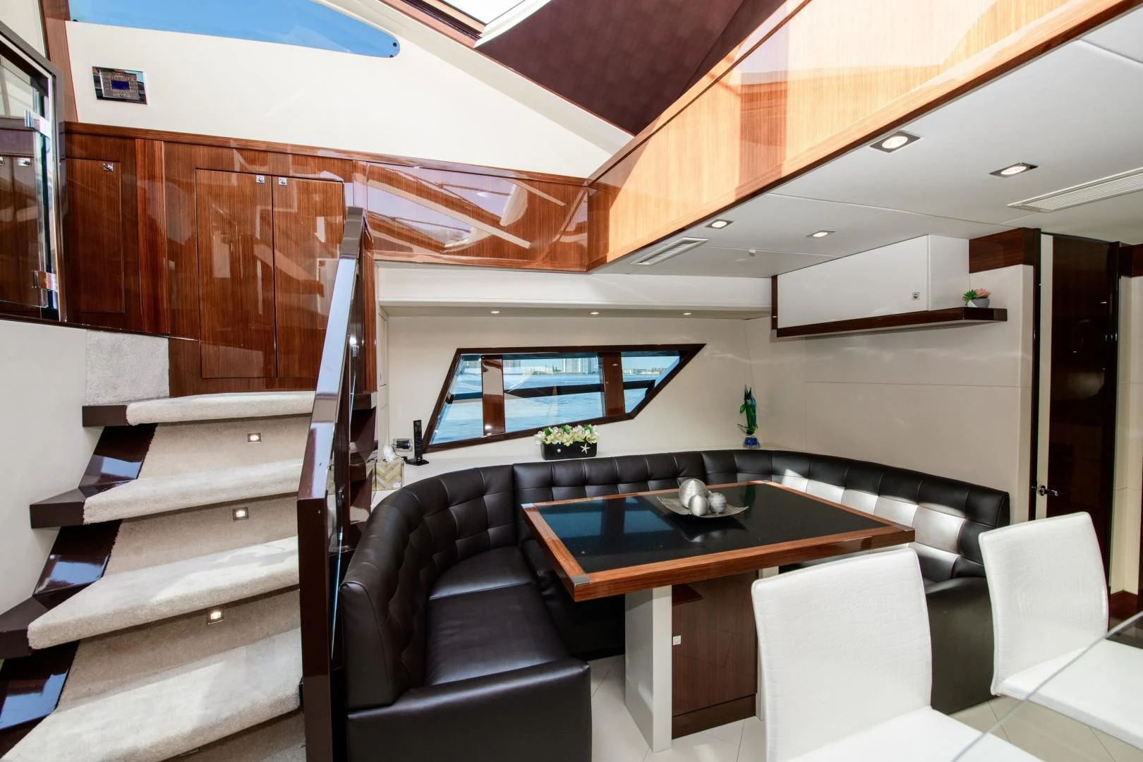 a room with a table and chairs aboard CHAPTER II Yacht for Sale