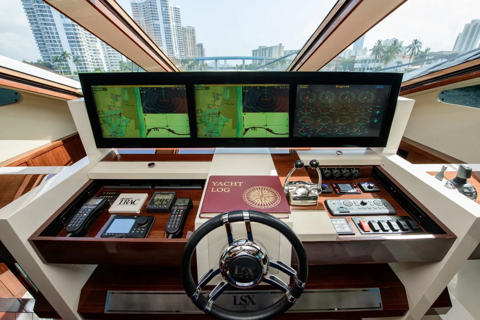 a computer monitor and a radio on a desk aboard CHAPTER II Yacht for Sale
