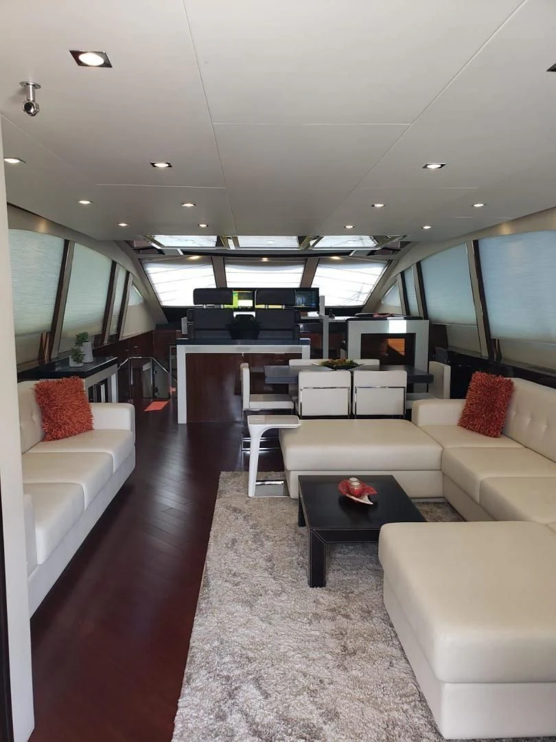 a living room with a large window aboard CHAPTER II Yacht for Sale