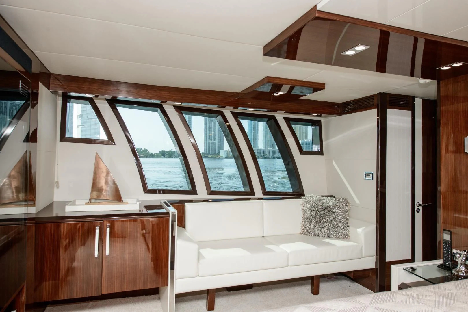 a room with a couch and a window aboard CHAPTER II Yacht for Sale