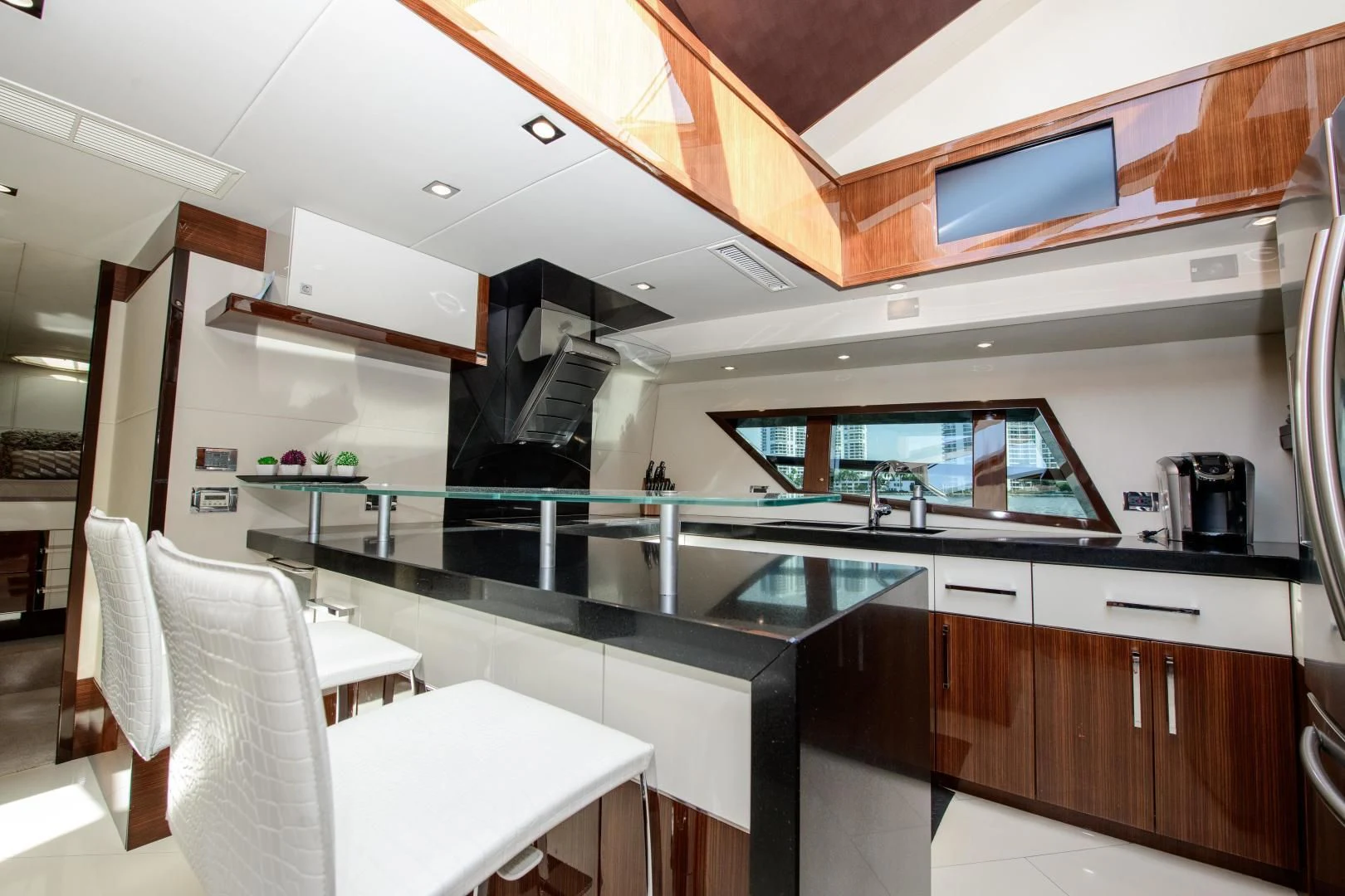 a kitchen with a large island aboard CHAPTER II Yacht for Sale