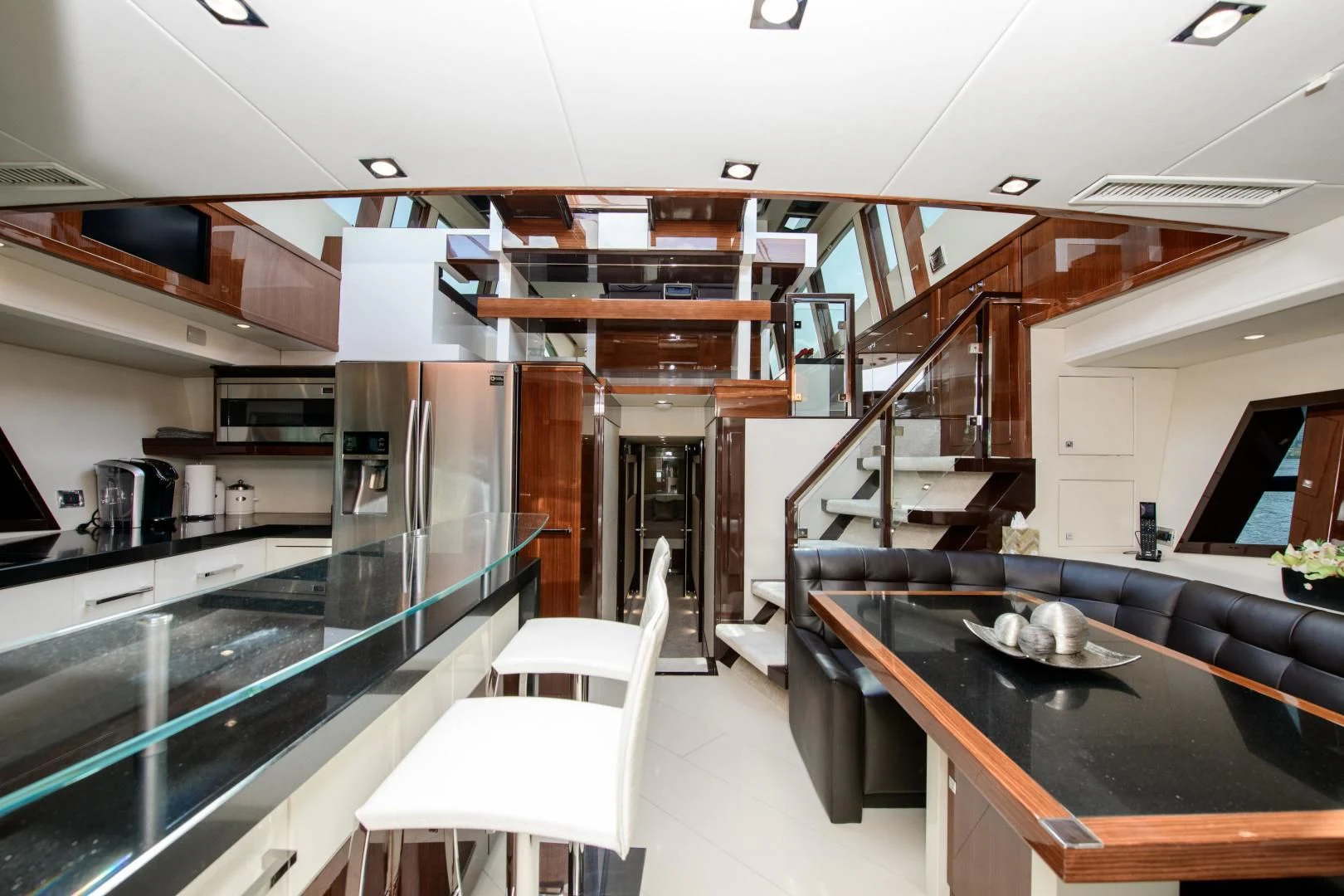 a kitchen with a bar and a bar aboard CHAPTER II Yacht for Sale